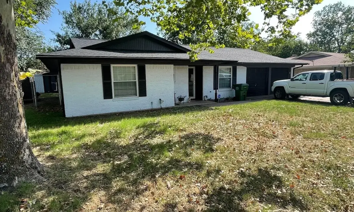 Professional roofing crew working on a residential roof in Guttenberg